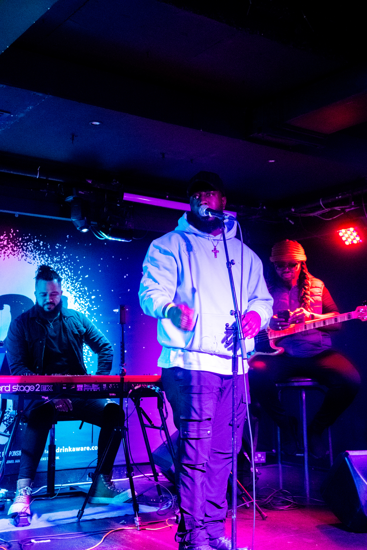 Ashley Zeal performing live on stage.