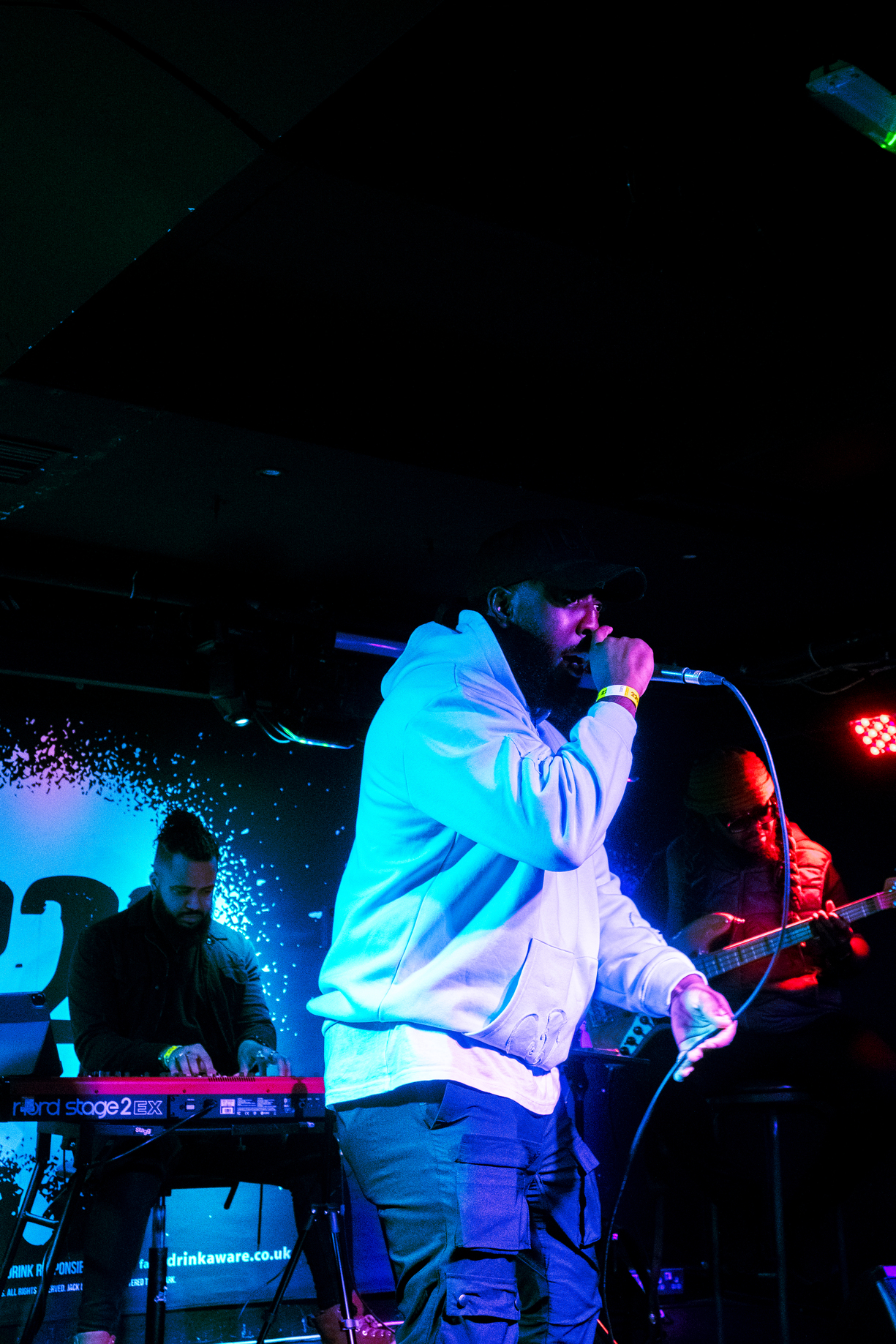 Ashley Zeal performing live on stage.